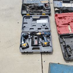 Ryobi 14.4V cordless drill set, which includes the drill, a battery, a charger, and a case.