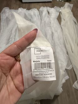 5 white curtains 2 beige ($5 each)