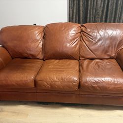 Leather couch and chair with ottoman