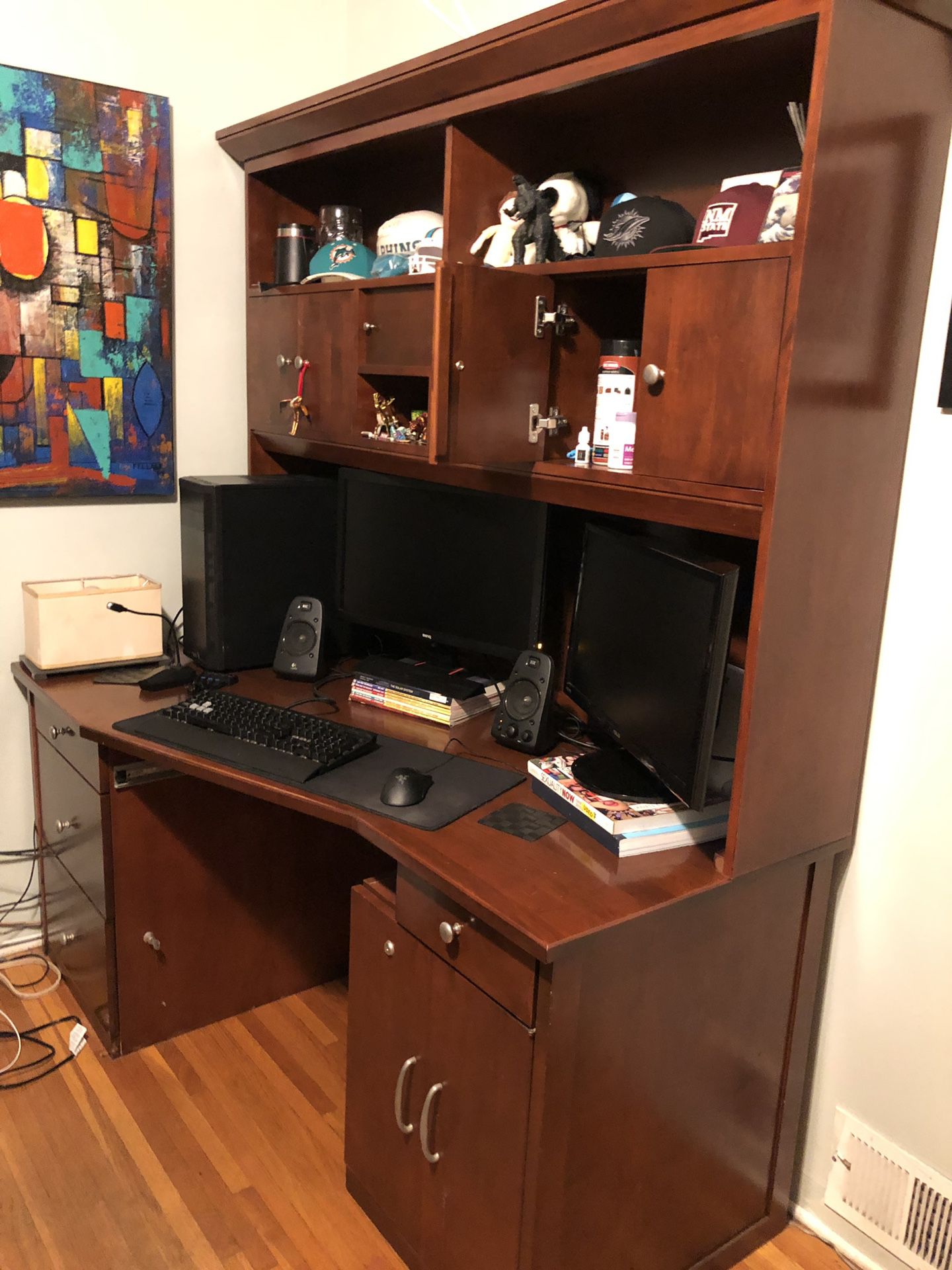 2 pc desk set made of solid wood construction throughout, lots of file drawers and cabinet space w pullout sliding desk . Also included built-in ligh