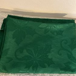 DARK GREEN OBLONG TABLECLOTH WITH POINSETTIA PATTERN - $10