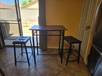 Bistro set tabletop with two stools