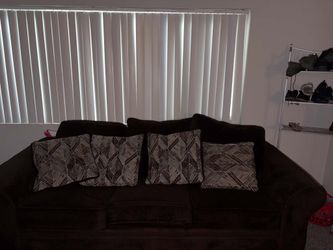 The couch is like new it's brown it's 2 a1 big one one small comes with all the  pillows