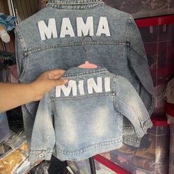 Woman’s Jean Jacket And Baby 