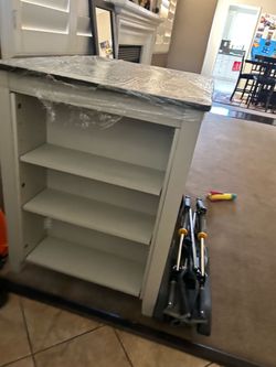 Small kitchen table with two chairs pretty brand new.