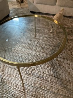 Round coffee table with gold legs