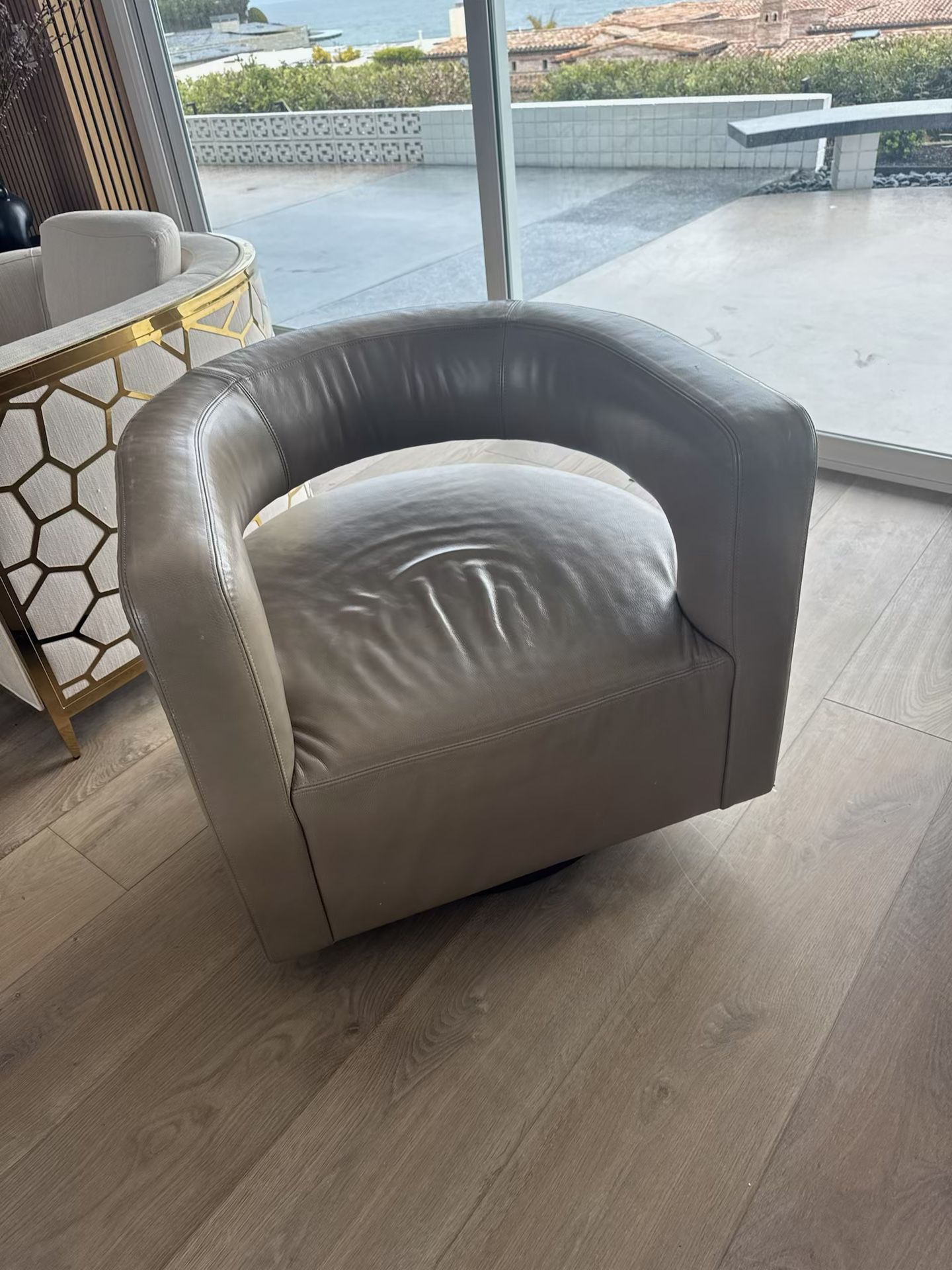 RH DREW CURVED LEATHER SWIVEL CHAIR