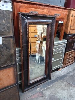 Vintage leather wrapped beveled wall mirror