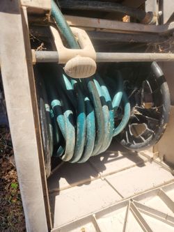 Garden hose and Reel  Box 100Ft. "In Good Working Condition "