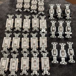 Lot of 28 Legrand Pass Seymour Hard Use 120V  switches and outlets 1 pole and 2 poles mixed    Fe)