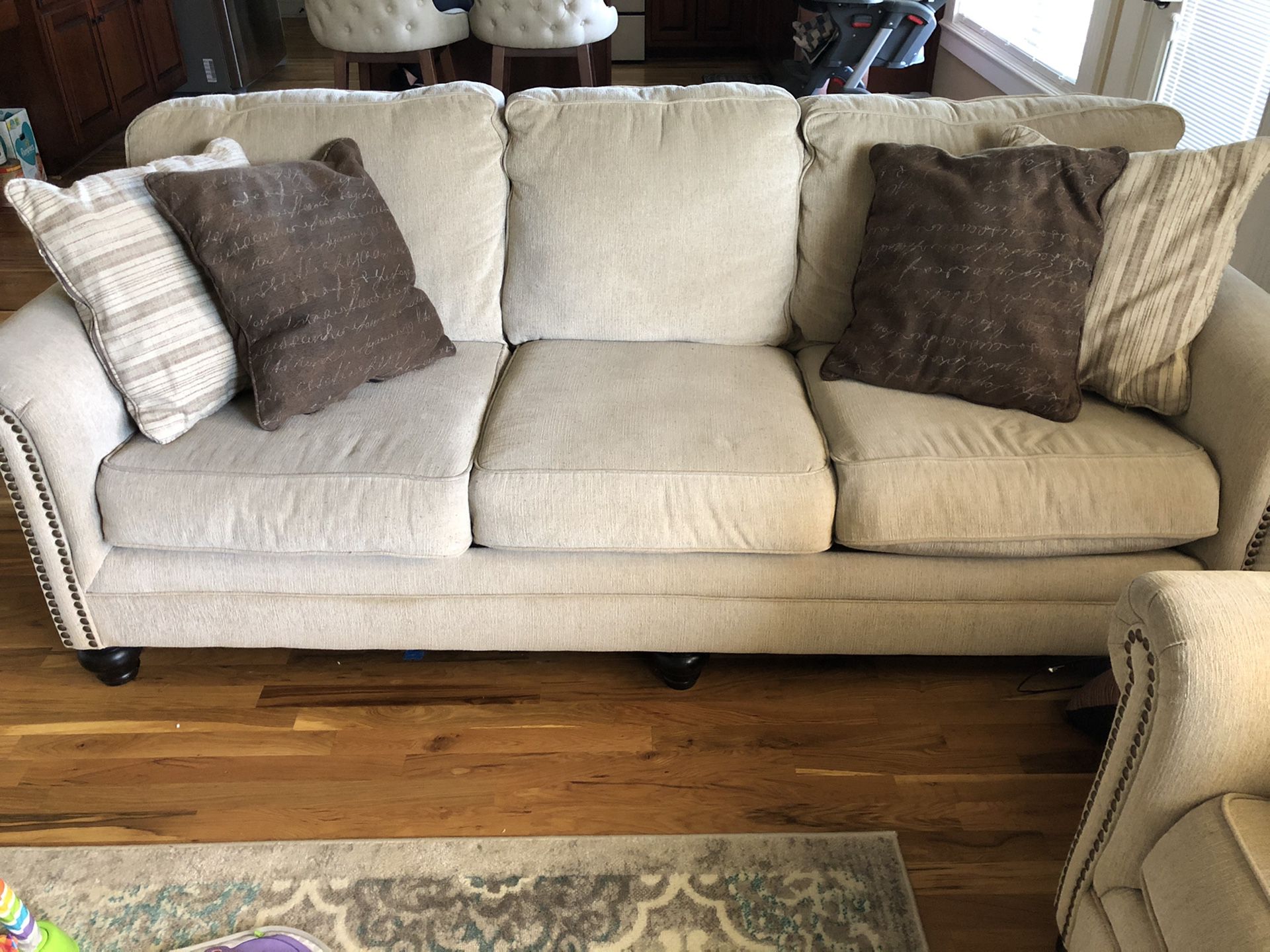 Beige Ashley Furniture Couches (2)