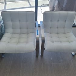 Pair of White Faux Leather Lounge Chairs