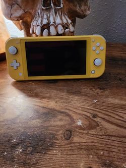 Nintendo Switch Lite-Yellow with two games and 64GB memory card