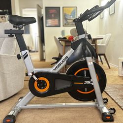 YOSUDA bike with magnetic resistance, tablet mount, and adjustable seat.