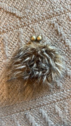 Claire’s furry clutch purse