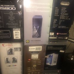 7 computer cases a bunch of laptops for parts couple motherboards and laptop screens