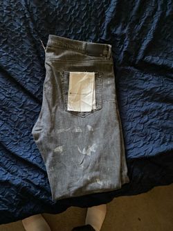 Purple jeans has front tag also