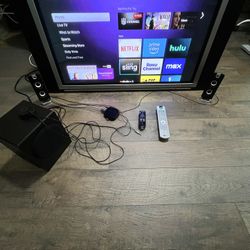 42 Inch LG Flat Screen with Roku Player and Surround Sound Speakers