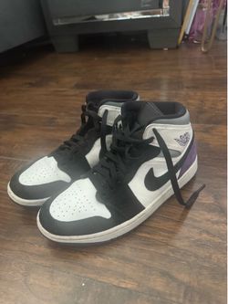 Black, white, and purple Jordan 1s