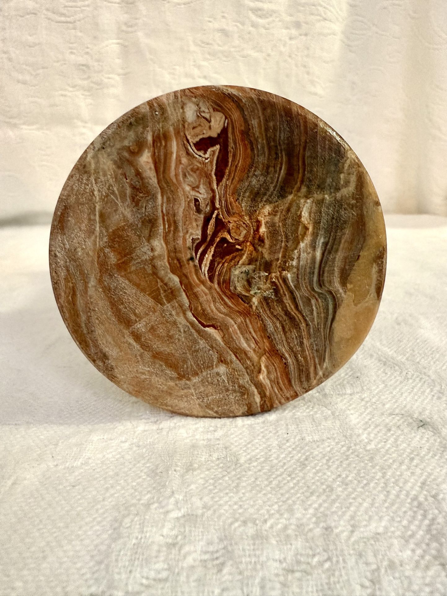 Onyx Vase 4”Wx8”T no flaws reds browns grays intricate graining.