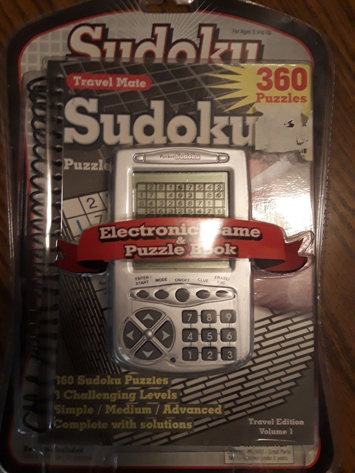 Sudoku hand held game and puzzle book brand new never opened