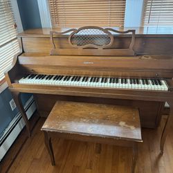 Harrington Piano with music books