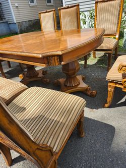 Dinner table with 8 chairs has extended leave long 71 W 47