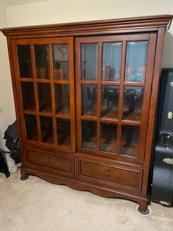 Sturdy wood cabinet with glass sliding doors
