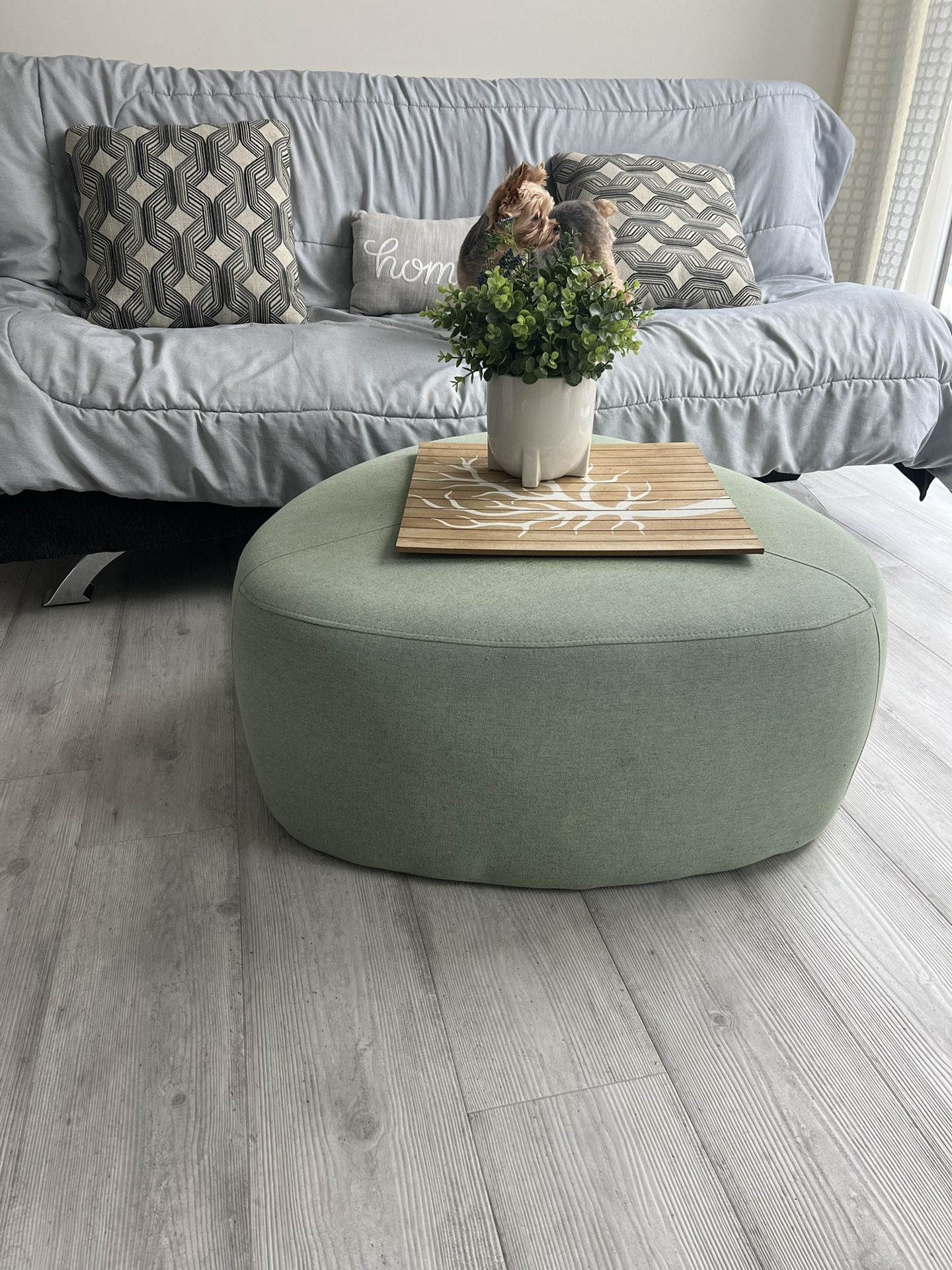 Green Color Fabric Ottoman/Coffee Table With Wheels.