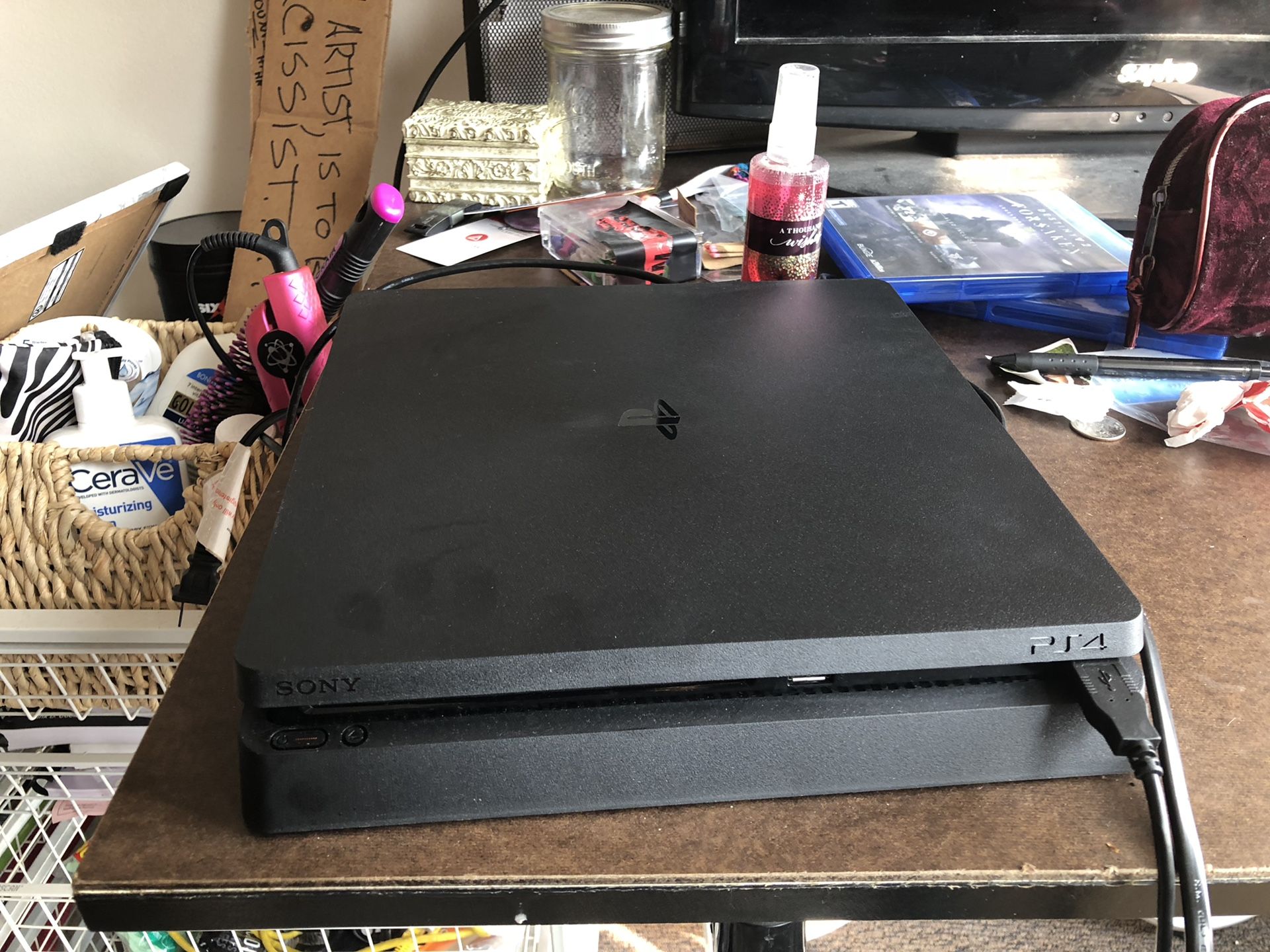 Barely used PS4 w/ games
