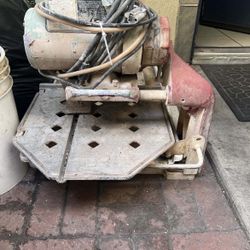 That machine you got there is an MK (MK Diamond) wet tile/brick saw—used for cutting tile, stone, concrete, etc.