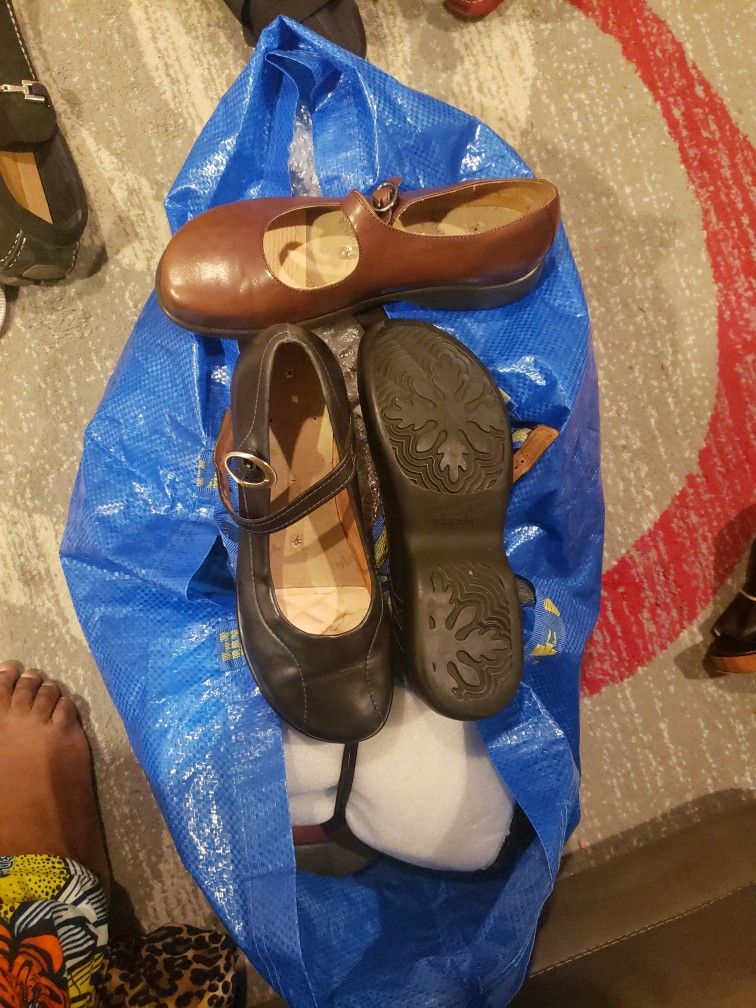 8 Dansko Clogs and 1 Allegria Snake Skin Clogs. Each Pair Is $70.