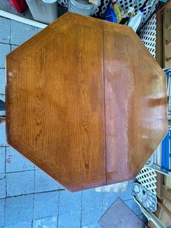 Wooden table with chairs not exactly the original table match well