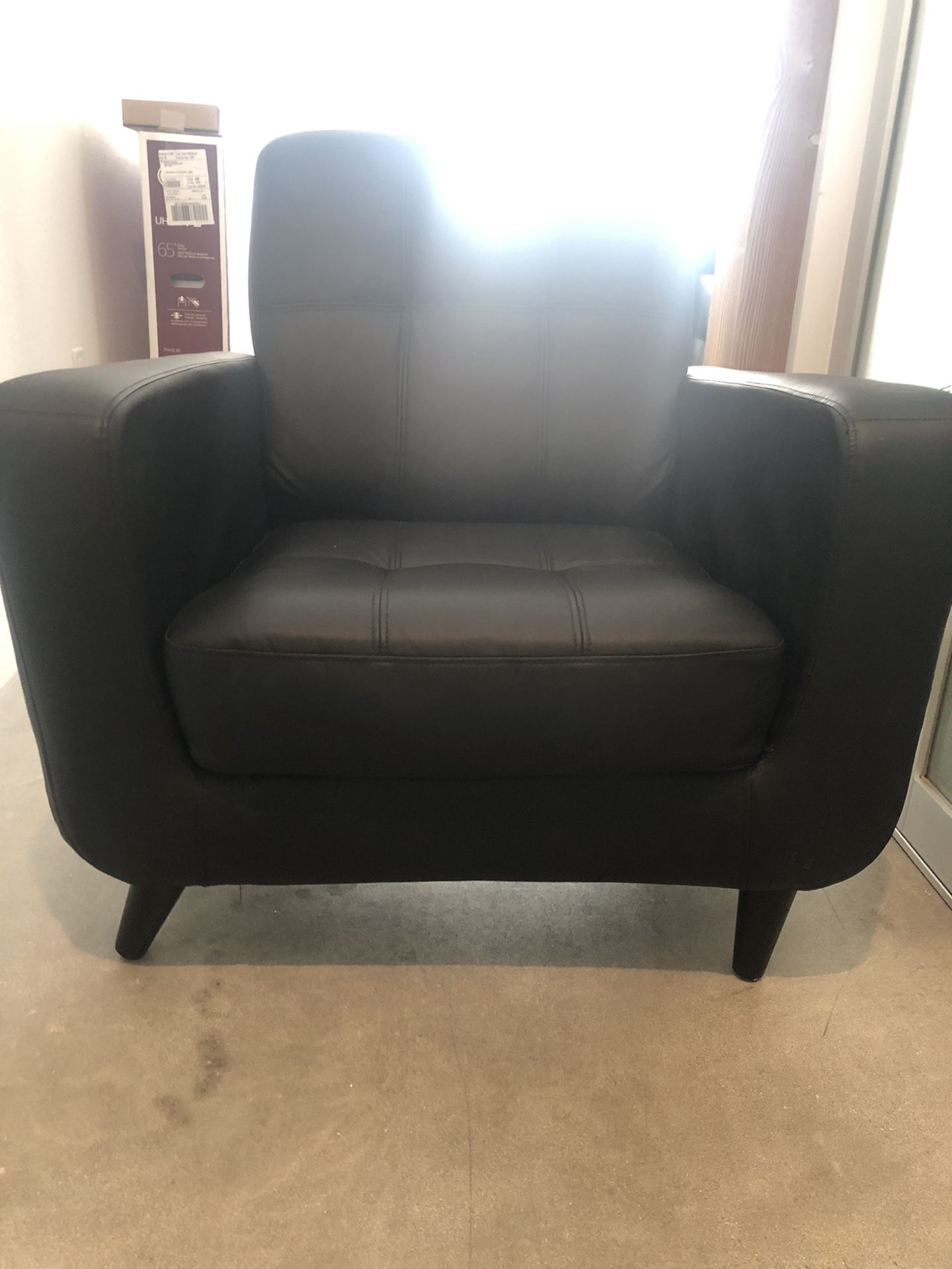 Black faux leather love seat