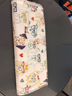 Adorable and whimsical Smart Dog “Boho” fabric featuring colorful illustrated dogs wearing glasses, sunglasses and bow ties with scattered hearts. Fun