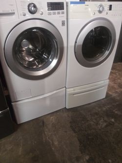 LG front load washer and dryer set with pedestals in excellent conditions