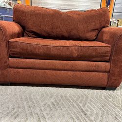 Loveseat with pull out mattress.
