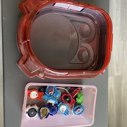 Assorted Beyblades And Stadium