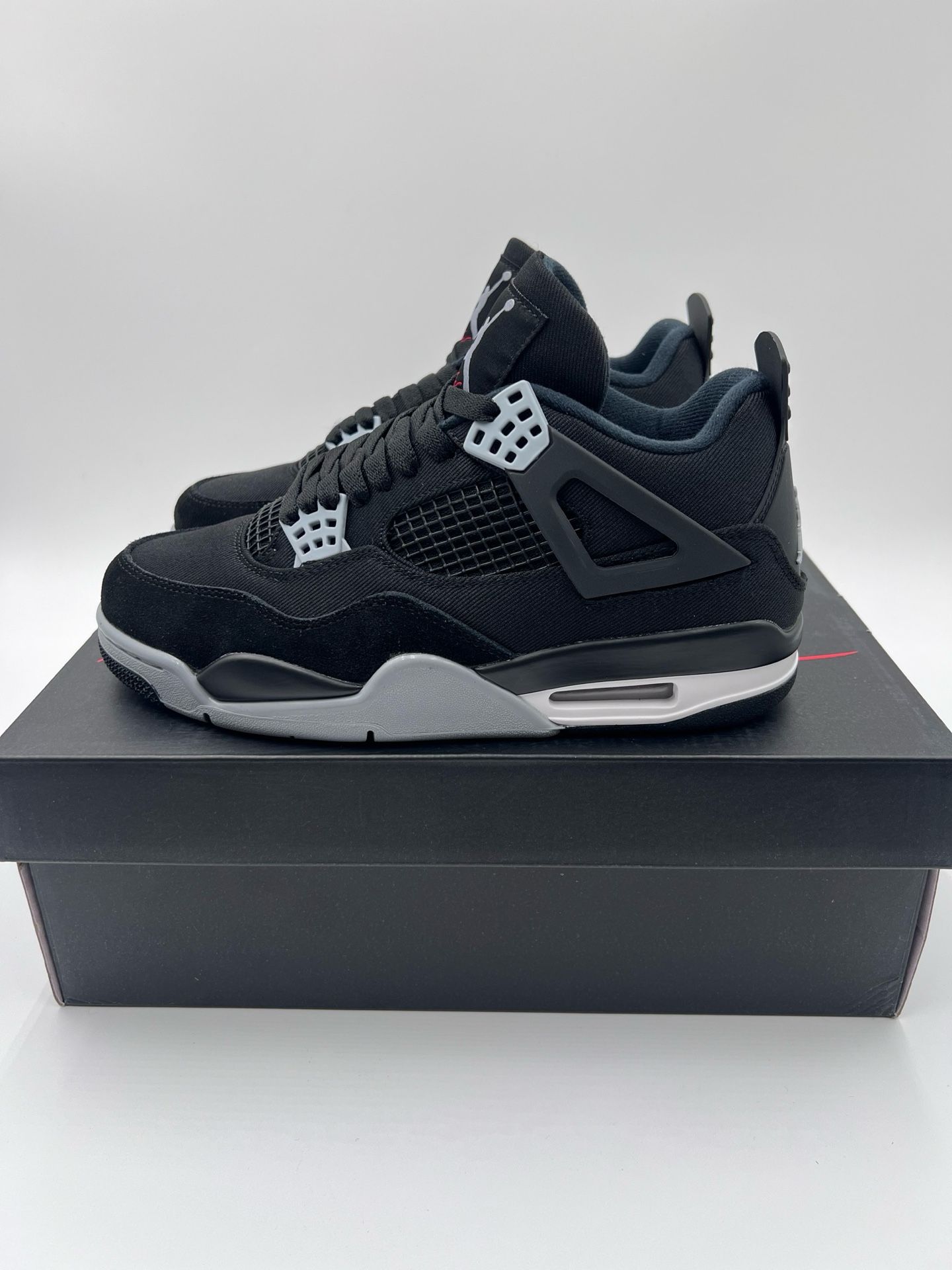 Black Canvas Jordan 4 Retro