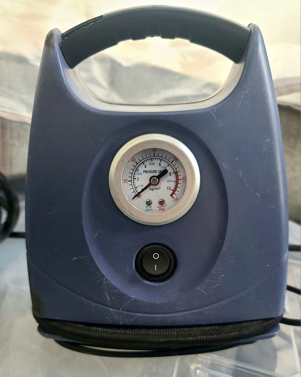 Portable Car Air Pump powered by cigarette adapter