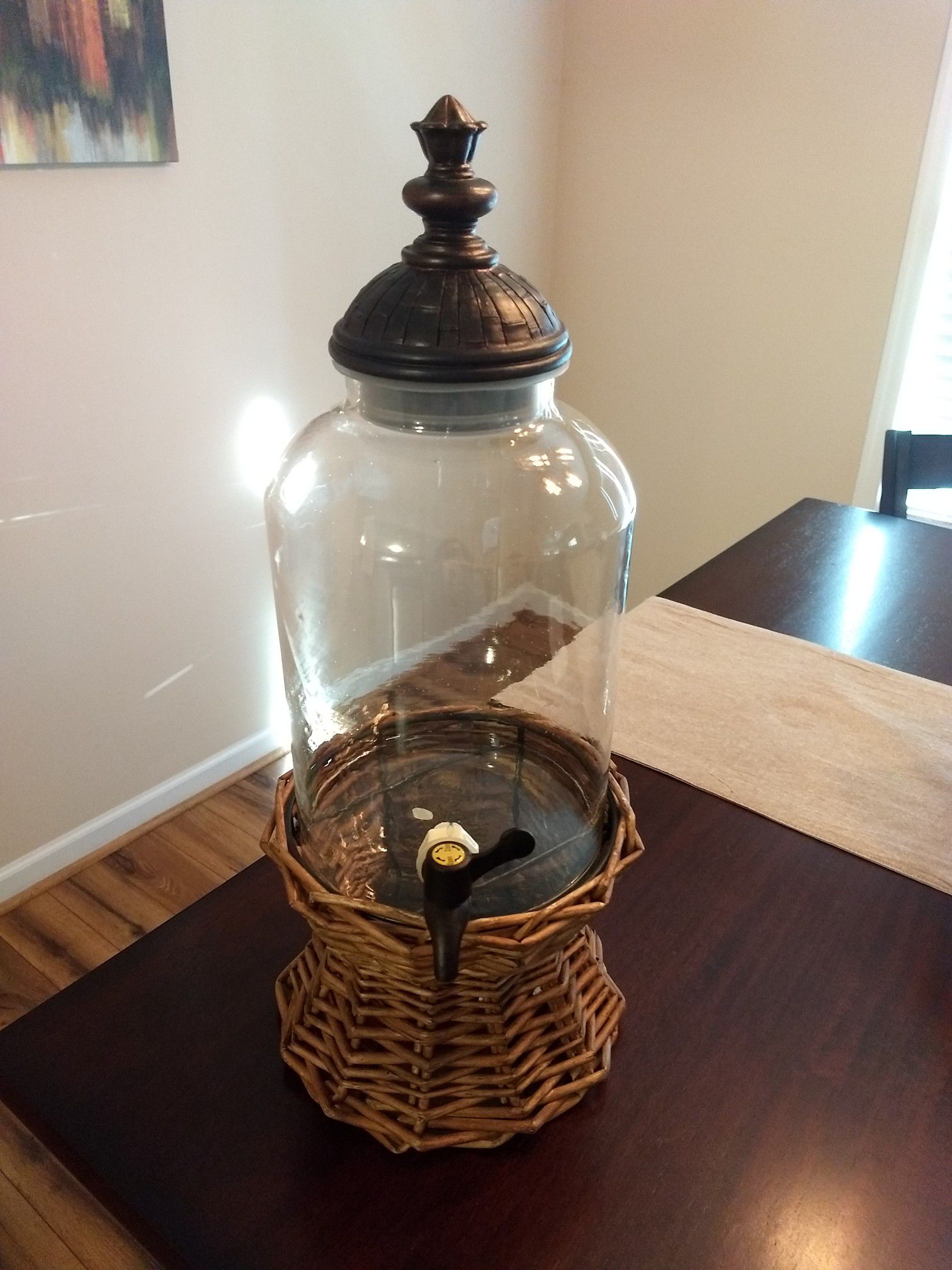 Glass drink dispenser with wicker base