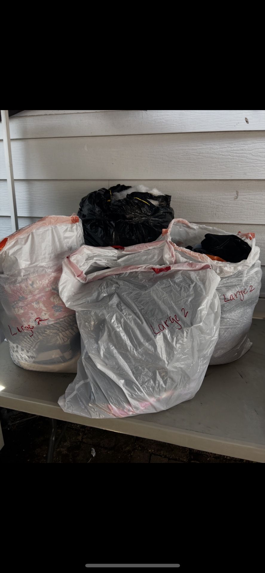 4 BIG BAGS OF WOMENS SIZE LARGE CLOTHES