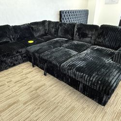 New Black Sectional With Pull Out Bed And Chaise Storage