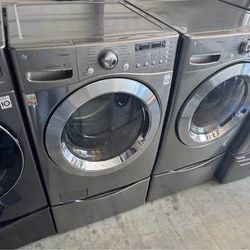 Graphite steel Front load lg washer and front load lg dryer with pedestals working perfectly extra for delivery same day delivery and installation ava