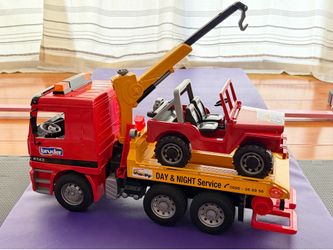 $50 Like New Bruder Tow Truck Toy with Crane and Jeep Toy