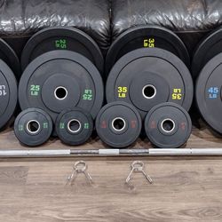
   OLYMPIC  BARBELL BAR  7ft.
 45lb. AND OLYMPIC BUMPER
  WEIGHT  PLATES.
