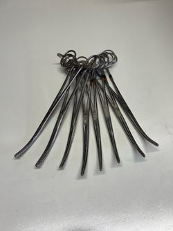 Set of 7 curved stainless steel hemostat clamps in good locking used condition.