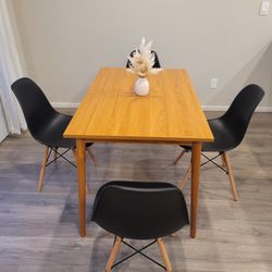 Brown Solid Wood Table and 4 Black Chairs