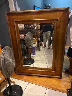 Big Mirror with wood trim is size  58” x 46” n great shape