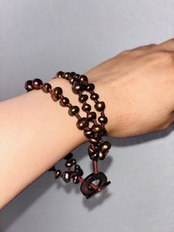chocolate brown baroque freshwater pearls on brown cord with a toggle clasp.